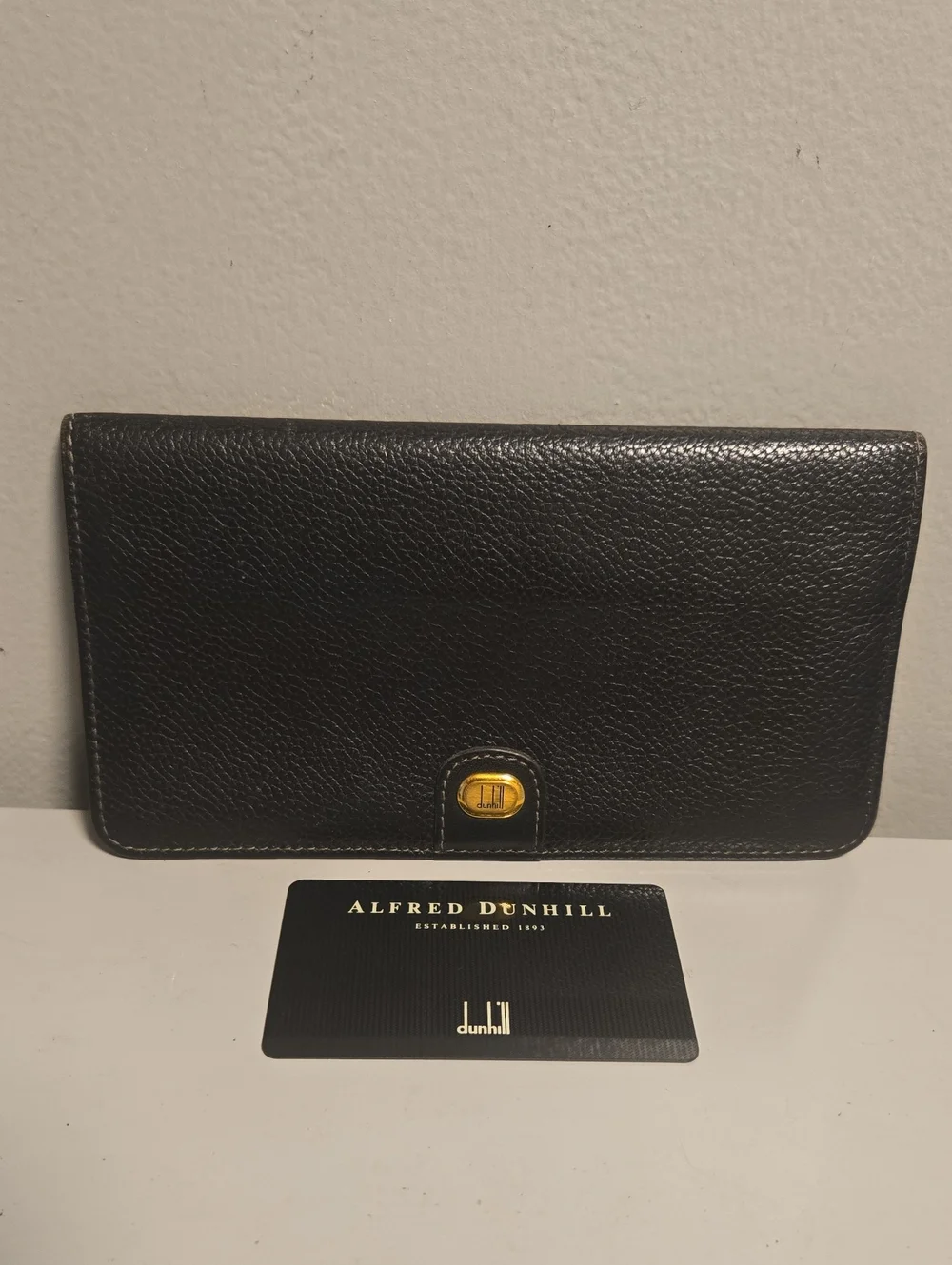 Dunhill Black Pebble Leather Continental Wallet with Gold Accent